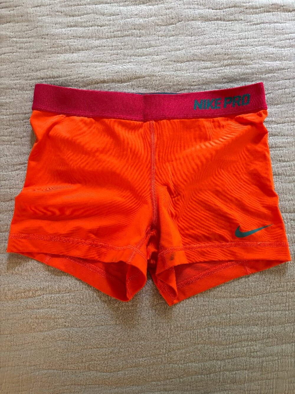 Orange and Pink Nike Pros